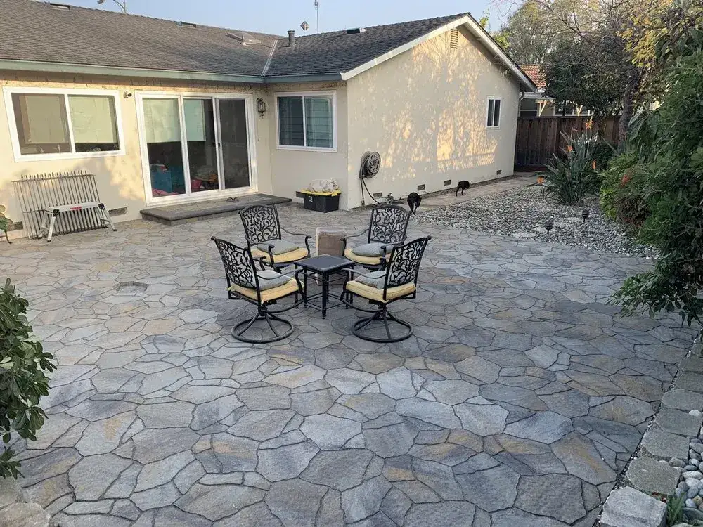Flagstone patio with an outdoor dining set