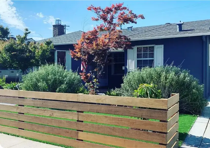 Front yard with artificial turf, lavender and a horizontal slat fence