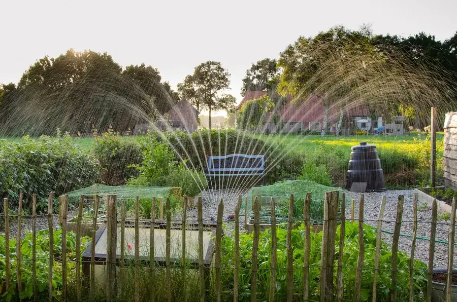 Sprinkler irrigation watering a garden lawn