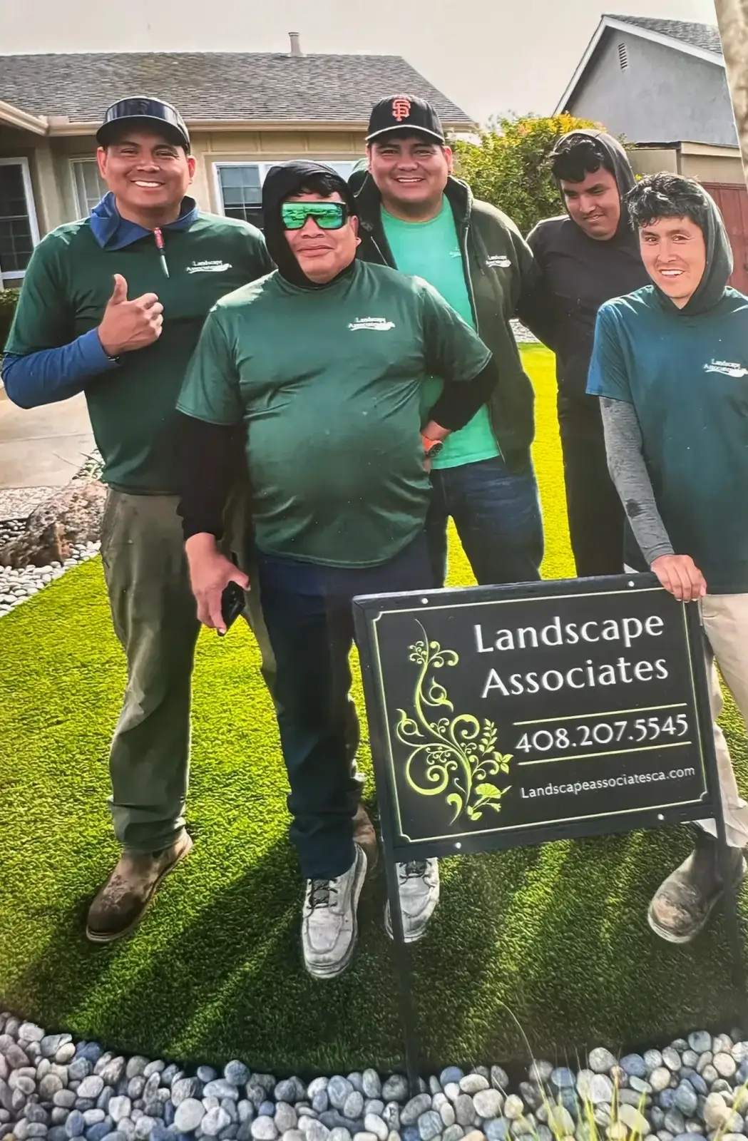 Landscape Associates of CA crew standing in a completed front yard.
