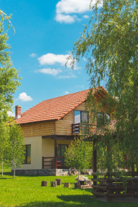 brown-beige-house-landscape-surrounded-trees