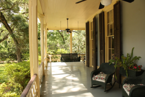 Front porch of a house, showcasing hardscape elements in the exterior design