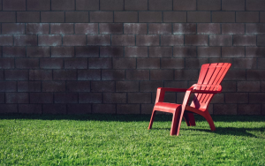 A boundary retaining wall surrounding a backyard.