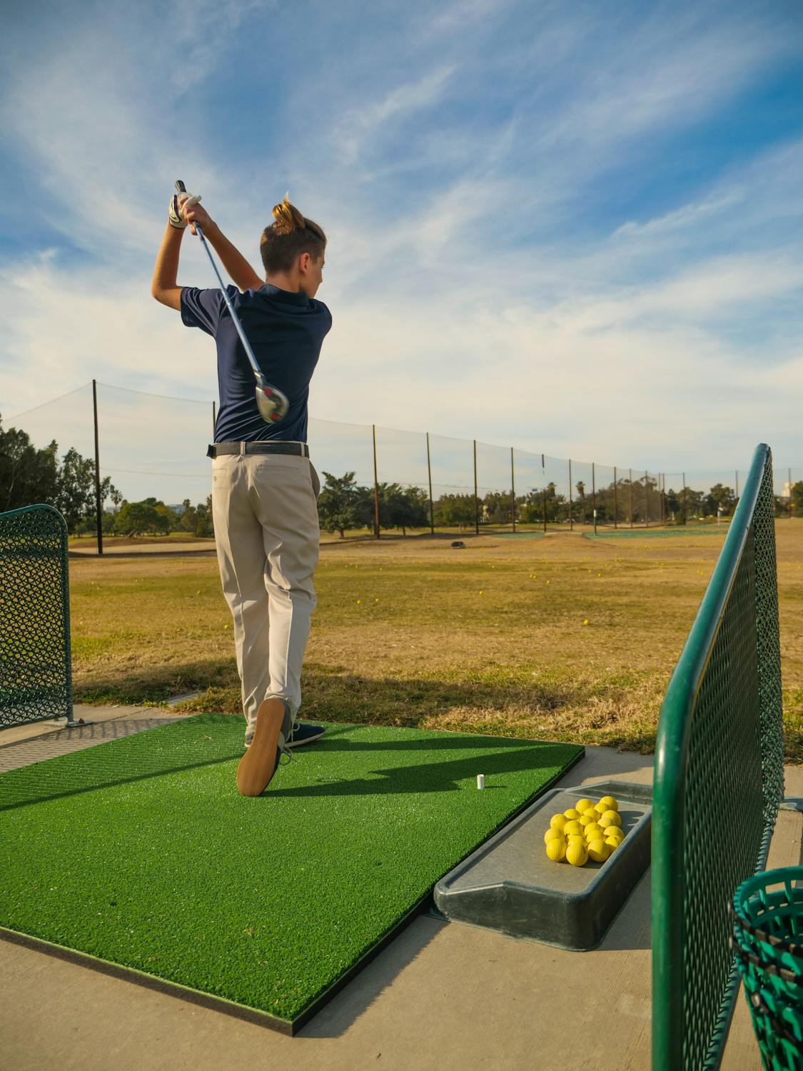 A patch of turf for playing golf.