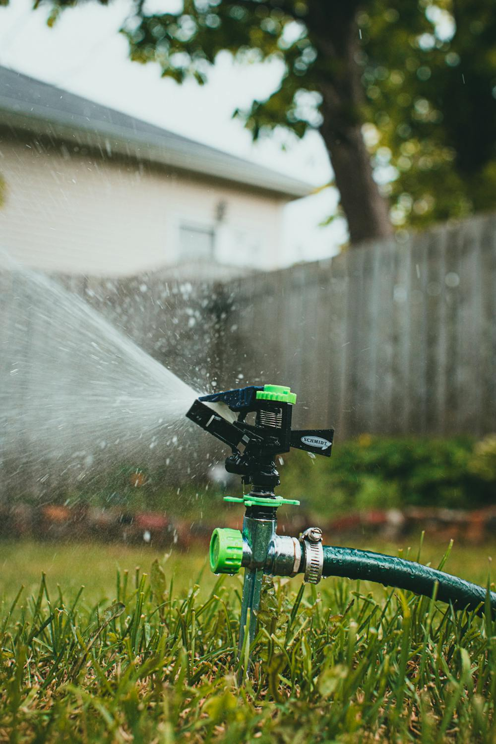 A sprinkler in a garden